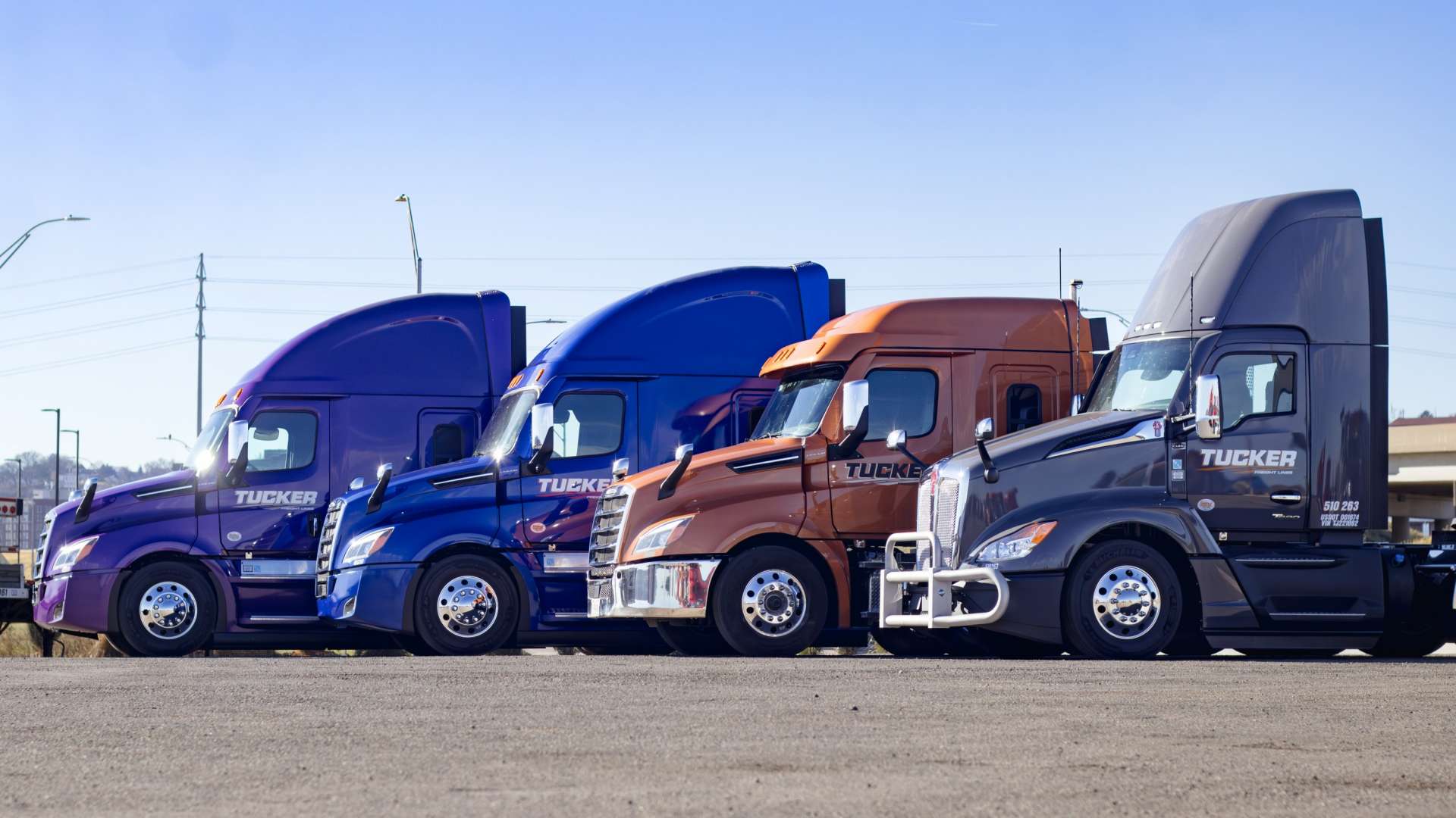 Tucker Freight Lines trucks staggered at an angle