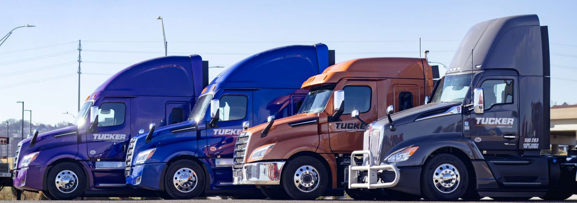 Tucker Freight Semi Trucks staggered outside