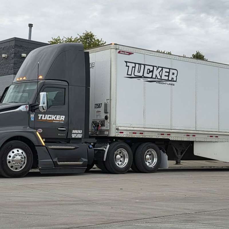 2 green Tucker Freight Lines trucks
