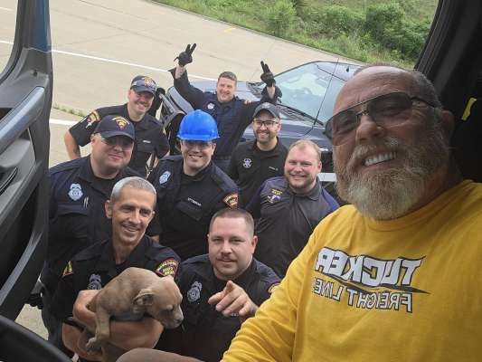 A CDL flatbed truck driver meeting with the DOT inspection officers.