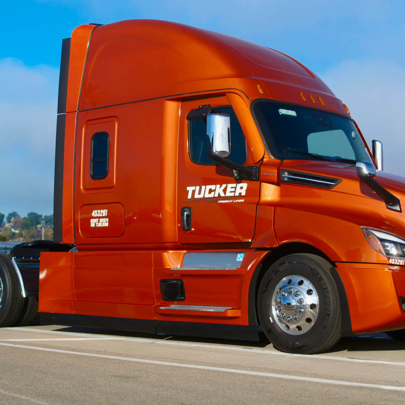 Tucker Freight Orange Dry Van Over the Road Semi